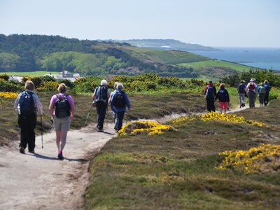 Valleys of Galway in Connemara National Park, Ireland - image depicting Ramblers holidays walking group following winding path