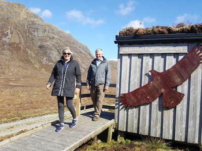 Two happy people descending ramp at North Harris Eagle Observatory, Scotland