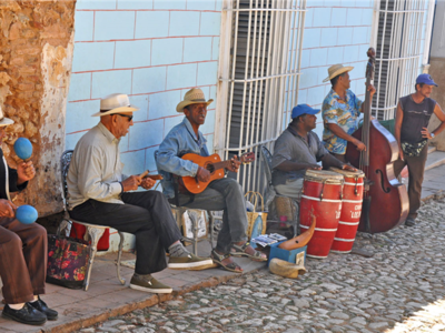 Cuban musicians performing on ten cobbled street, Cuba