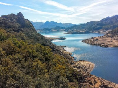 Mountainous landscape with blue river zig-zagging through, Barragem de Paradela - Penada Geres national park, Portugal