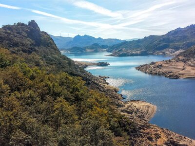 Mountainous landscape with blue river zig-zagging through, Barragem de Paradela - Penada Geres national park, Portugal