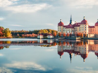 Panorama of Moritzburg Baroque palace surrounded by a lake. Great autumn sunrise in Saxony, Dresden location, Germany, Europe