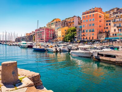 Colourful houses on the shore of Bastia port on bright morning, Corsica island, France, Europe