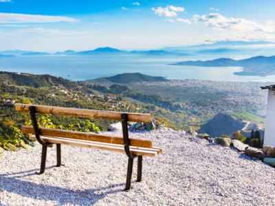Volos city view from Pelion mount with bench in foreground, Greece