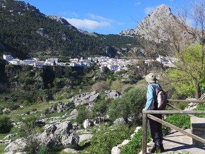 Person viewing white village from distance, Grazalema, Spain