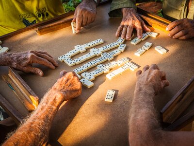 Old men playing dominoes on the street in Cuba