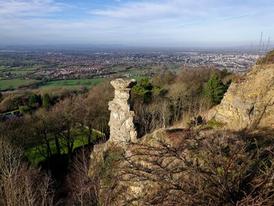 Devil's Chimney, Leckhampton Hill, with Cheltenham behind, Gloucestershire Limestone pillar