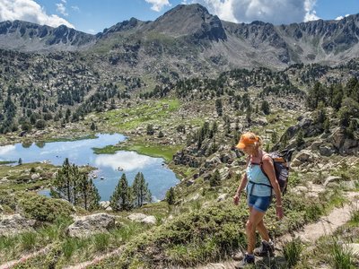Woman walking above the Pessons Lakes, Andorra, Europe