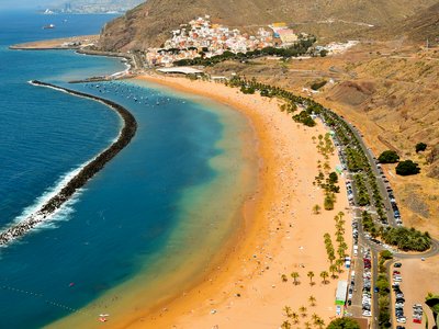 High point view of golden sand Teresitas Beach on sunny day, Tenerife, Spain
