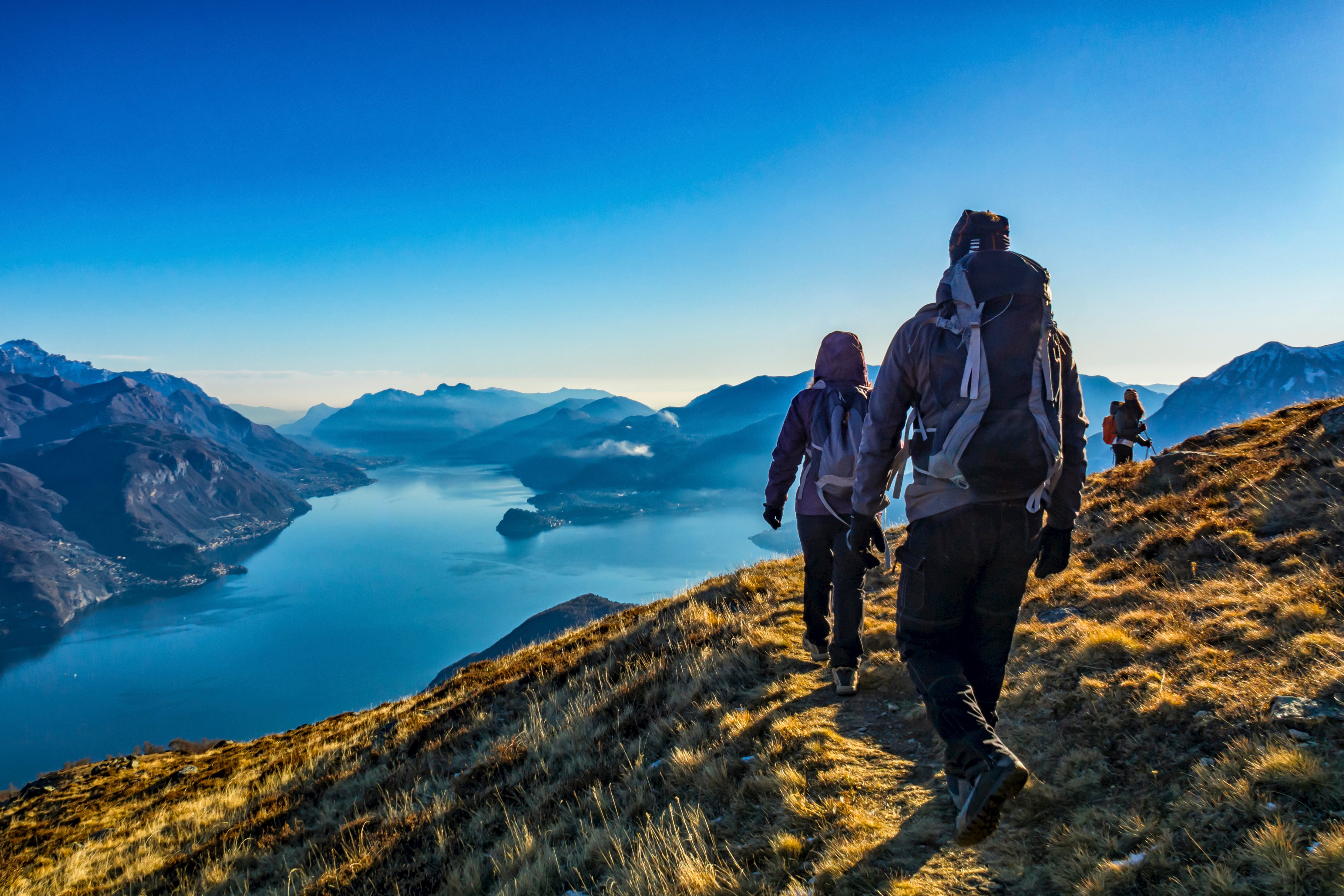 Self-guided walking group trekking atop a mountain in Lake Como, Northern Italy’s Lombardy region