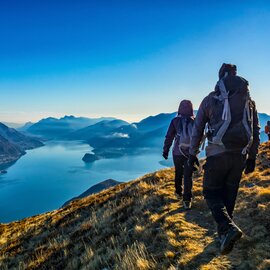 Self-guided walking group trekking atop a mountain in Lake Como, Northern Italy’s Lombardy region